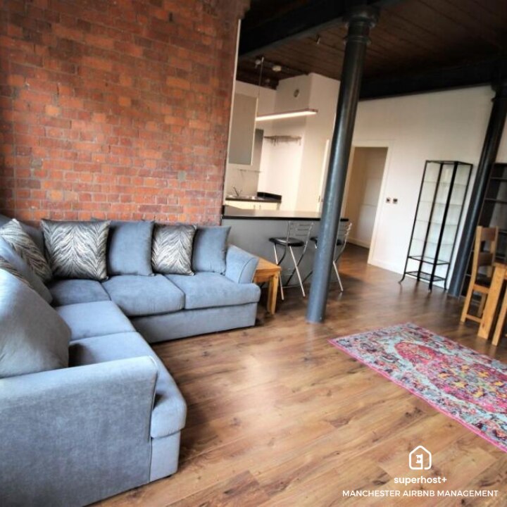 living room with gray sofa and throw pillows in manchester